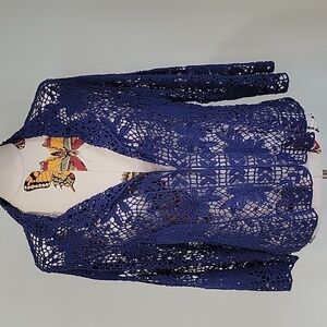 Blue crochet jacket with hook and eye closure.  No tags.